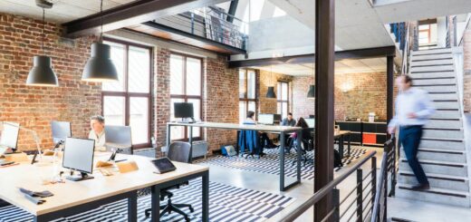 Spacious and stylish open-plan office with loft and industrial aesthetic.